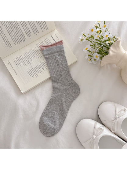 Side view of Rufia solid rib texture socks highlighting rib pattern