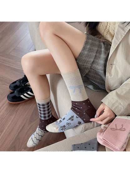 Close-up of Rufia crew sock showing delicate bow detail on ribbed cuff