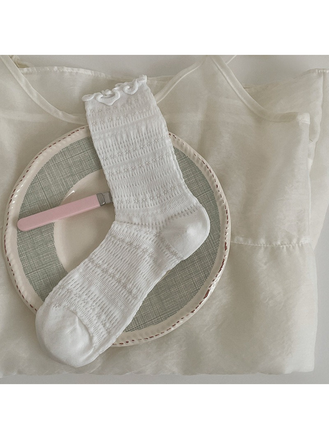 Side view of Rufia Sweet Ruffle Edge Socks highlighting ribbed texture