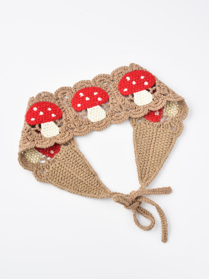 Side view of Haila crochet hairband highlighting mushroom detail and textured yarn