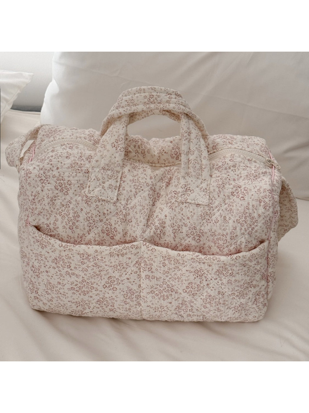 Side view of Cosbai padded floral travel bag showing handle and shape
