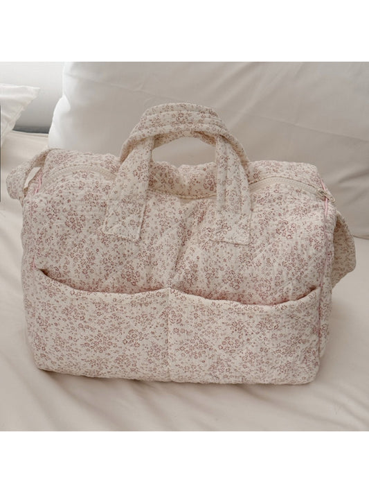 Side view of Cosbai padded floral travel bag showing handle and shape