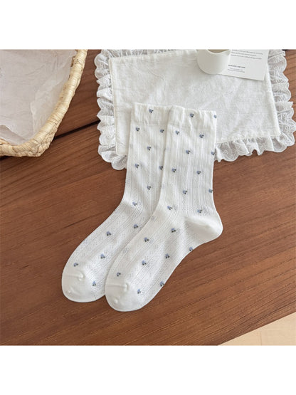 Close-up of Rufia socks fabric texture and detailed floral print