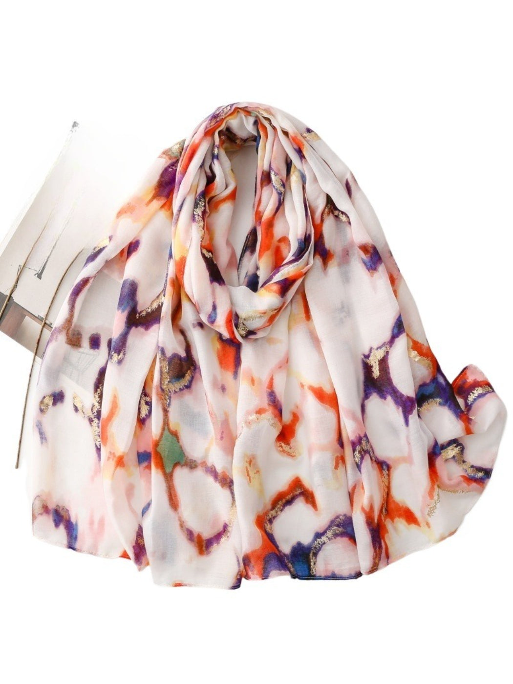 Model wearing the marble print scarf draped around the neck with casual outfit