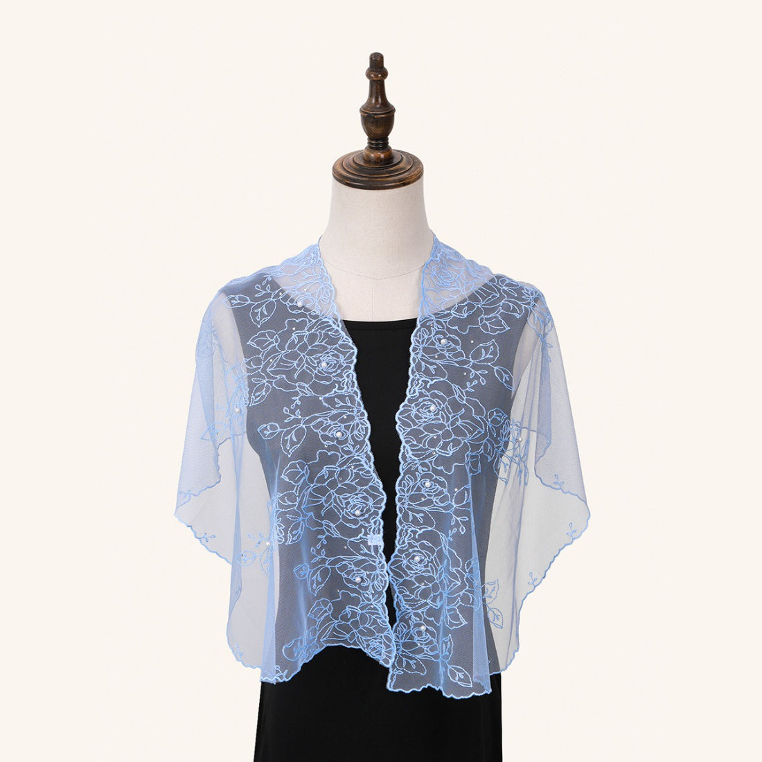 Folded Scarvii delicate floral wrap showing lightweight and translucent material