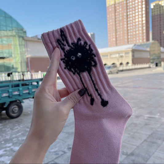 Close-up of Rufia socks showing abstract black and white spot design