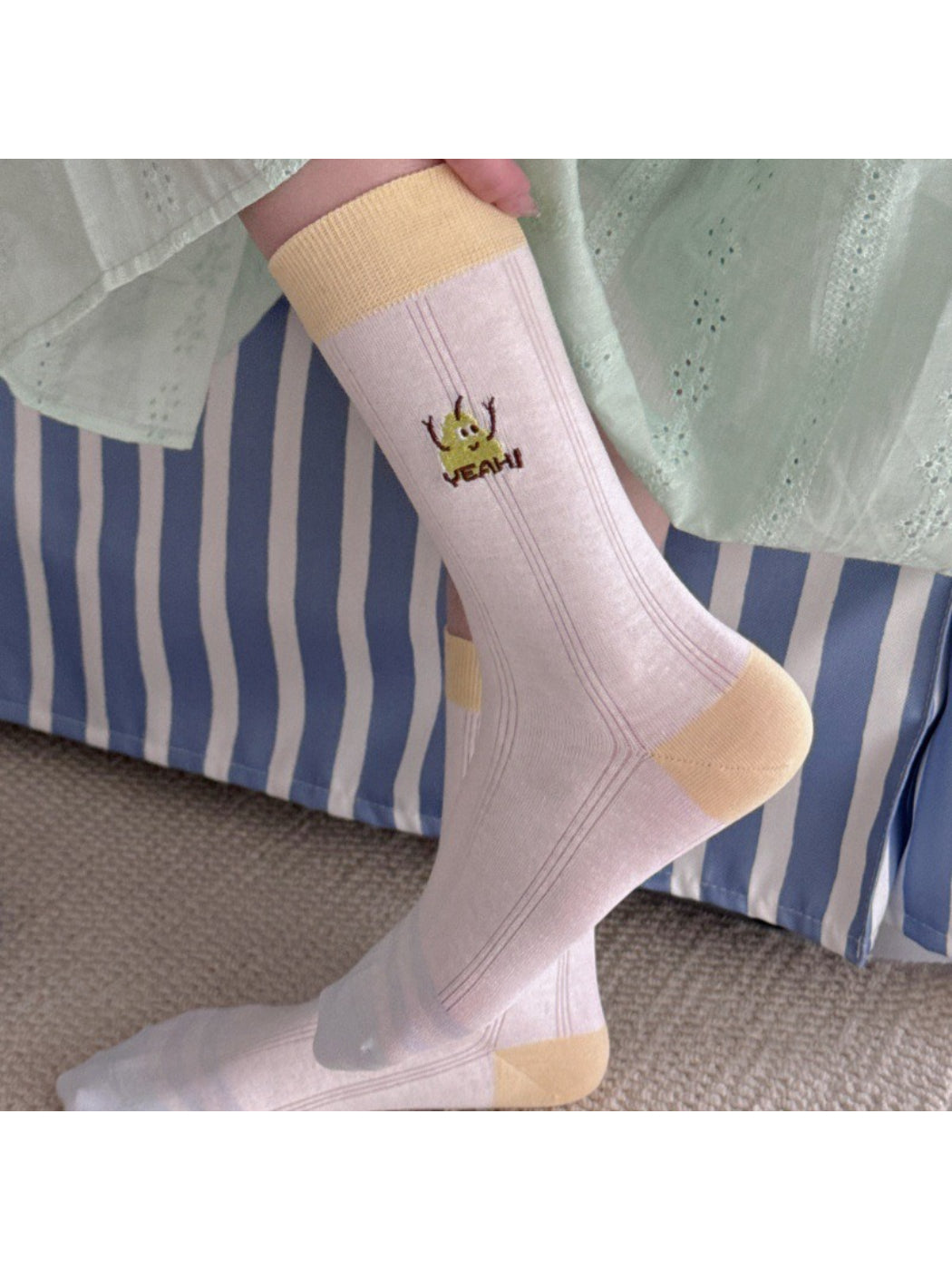 Pair of Rufia playful fruit detail socks in pastel colors laid flat
