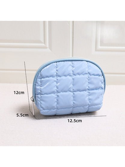 Top view of Cosbai Quilted Half Moon Cosmetic Case highlighting its compact size