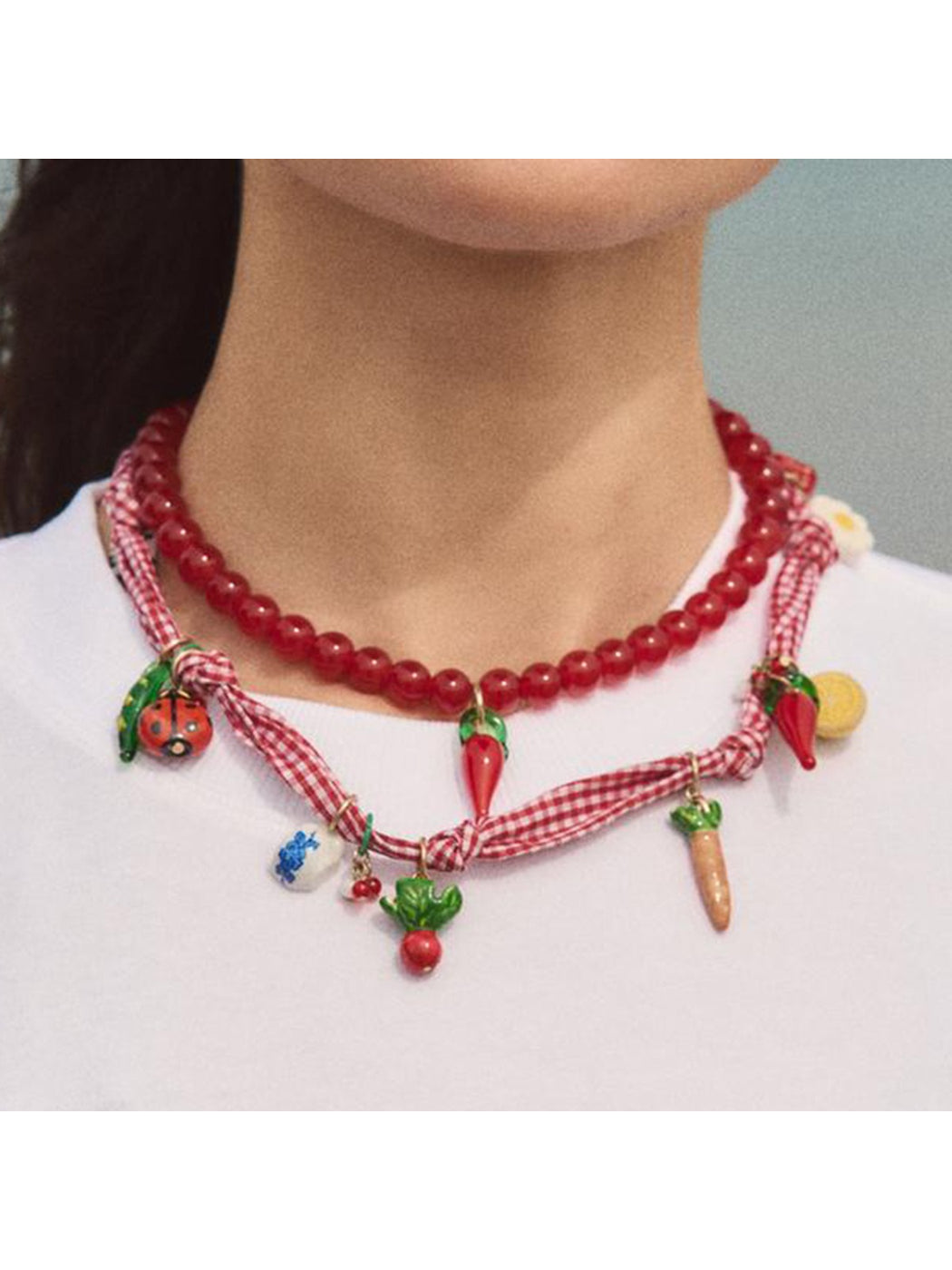Neckit Playful Food Charm Necklace with colorful food-themed charms on a silver chain