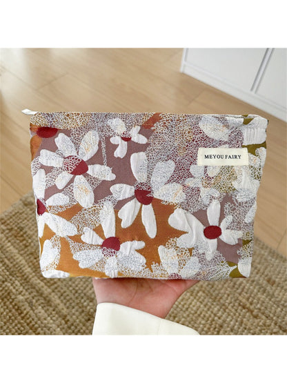 Cosbai makeup bag displayed with matching floral accessories
