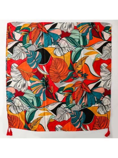 Scarvii scarf folded to show bold tropical design and tassel fringe