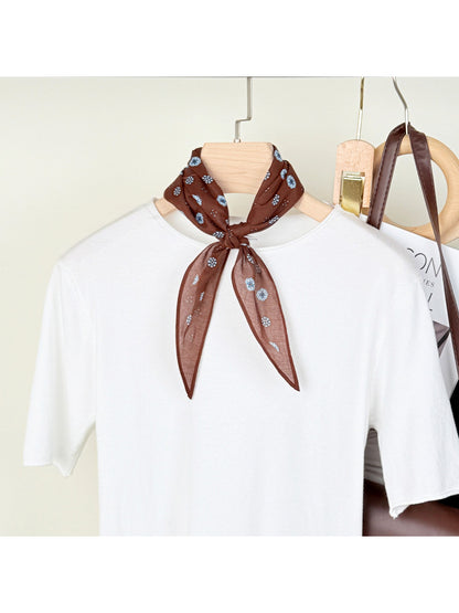 Model wearing Scarvii printed triangle neck scarf styled with casual outfit