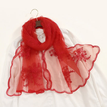 Detailed view of golden baroque embroidery on transparent Scarvii scarf
