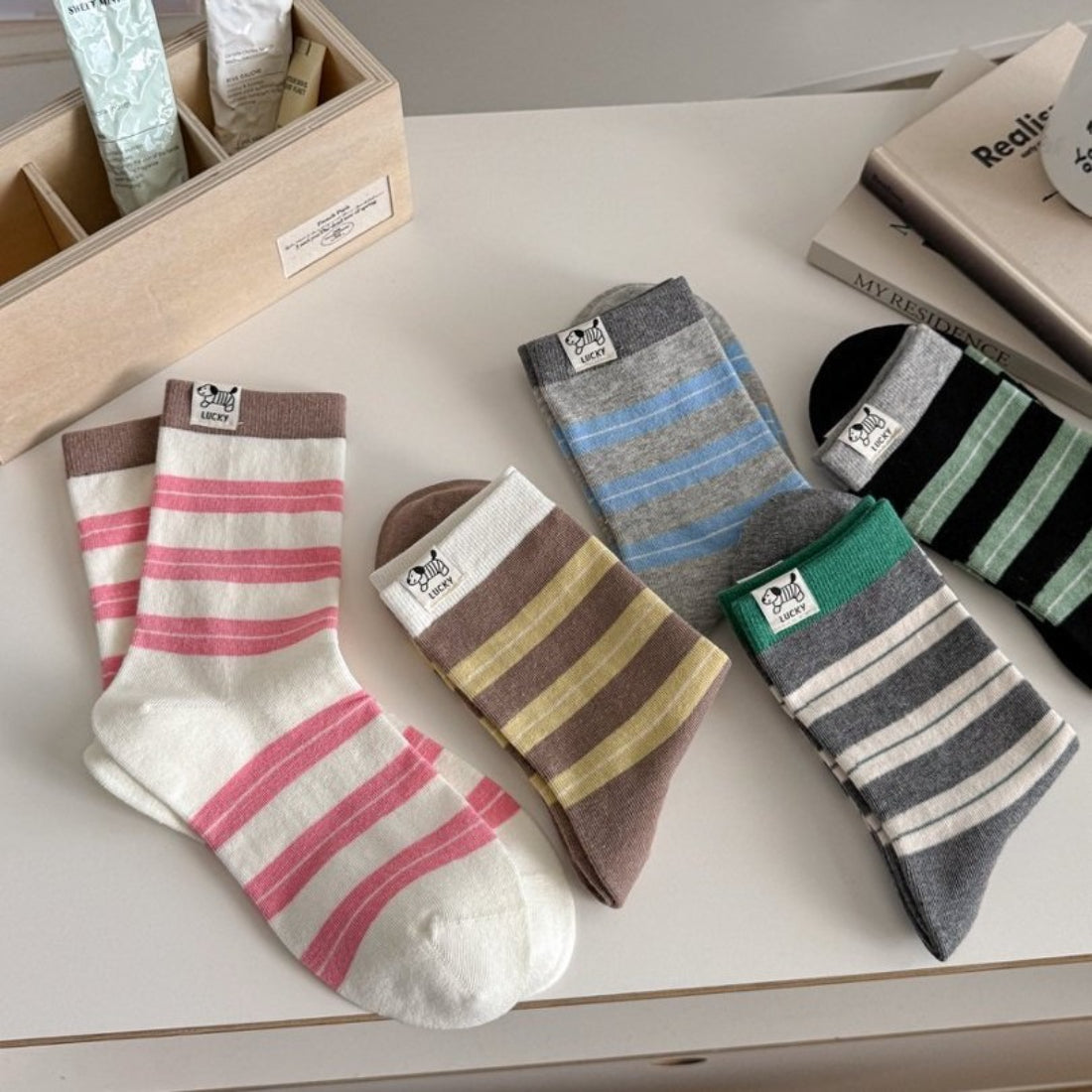 Pair of Rufia contrast stripe knit crew socks in white with black and red stripes