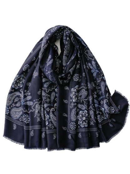 Scarf styled as a headwrap with visible paisley print and soft fabric