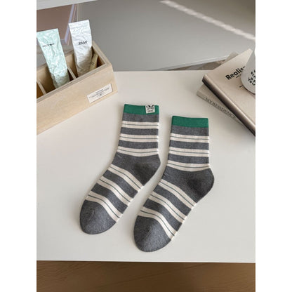 Side view of Rufia crew socks highlighting the stripe design along the cuff