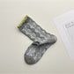 Rufia lace white mid-calf socks folded neatly with lace trim visible