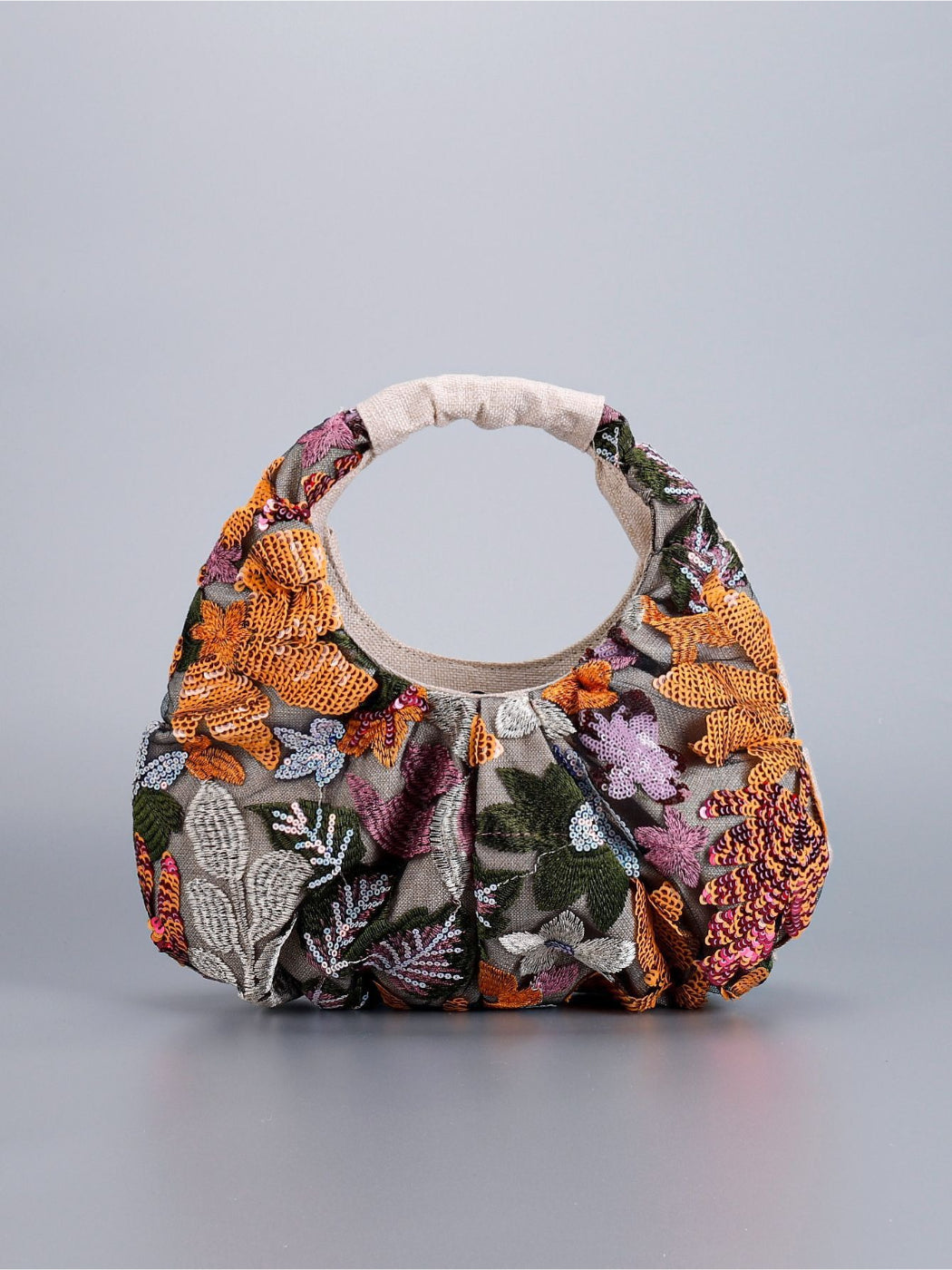 Top view of Cosbai hobo bag highlighting ruched handle and floral sequins