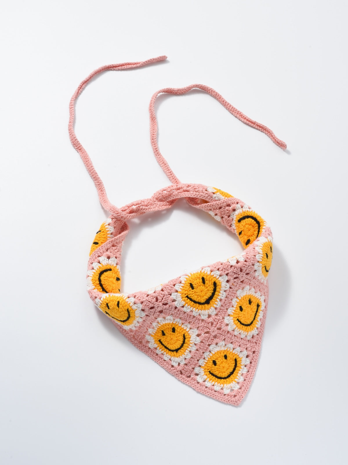 Scarvii crochet daisy smile hairband shown from a side angle