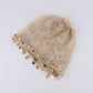 Side view of Haila hollow out knit mesh shell pattern beanie in beige