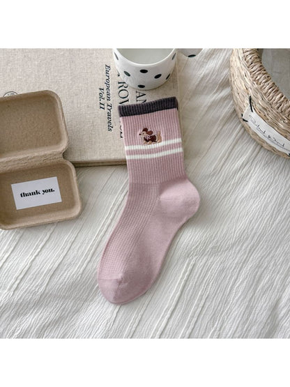 Rufia crew socks with dog embroidery worn on feet showing stripes