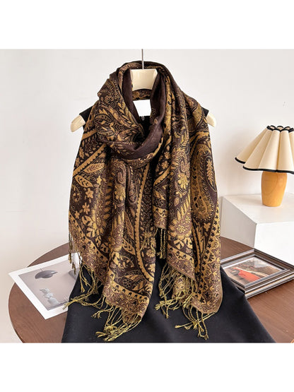 Scarf wrapped around model’s neck with tassels hanging down