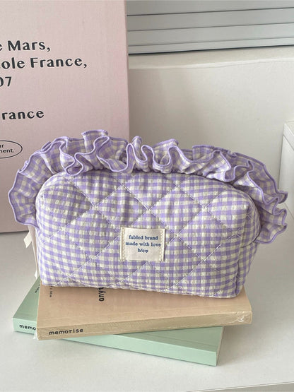 Cosbai gingham makeup bag open with cosmetics inside, showing interior space