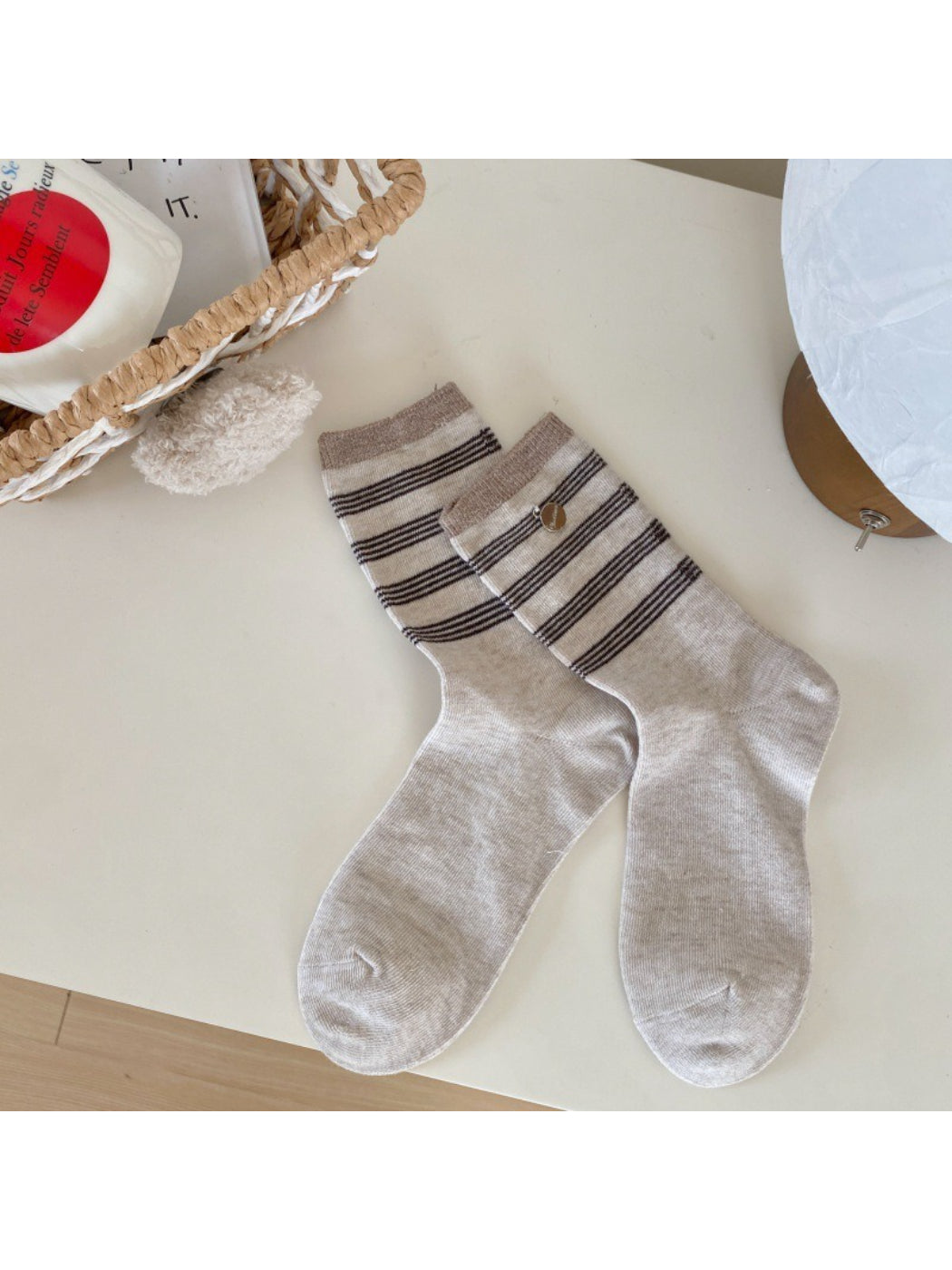 Stack of Rufia neutral crew socks in various neutral shades