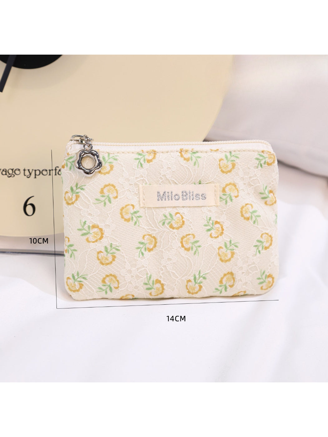 Cosbai floral coin purse photographed from side angle highlighting compact design
