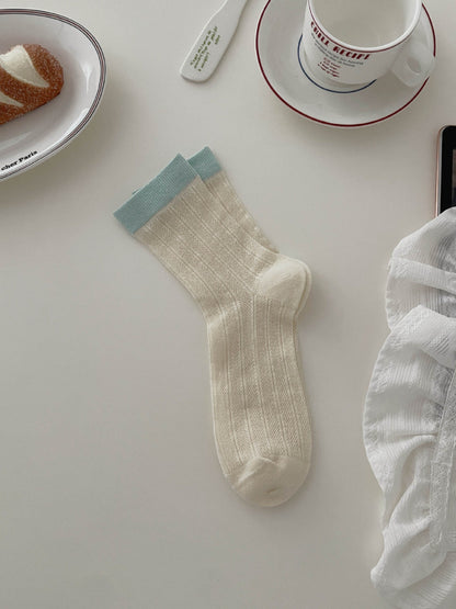 Model wearing Rufia soft tone contrast ribbed socks with casual shoes