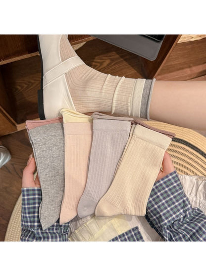 Rufia soft tone ribbed crew socks in beige paired with rolled-up pants