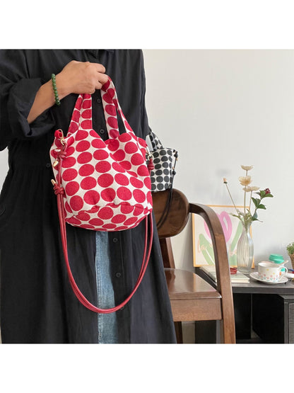 Side view of Cosbai Polka Dot Mini Tote Bag showing slim profile and handles