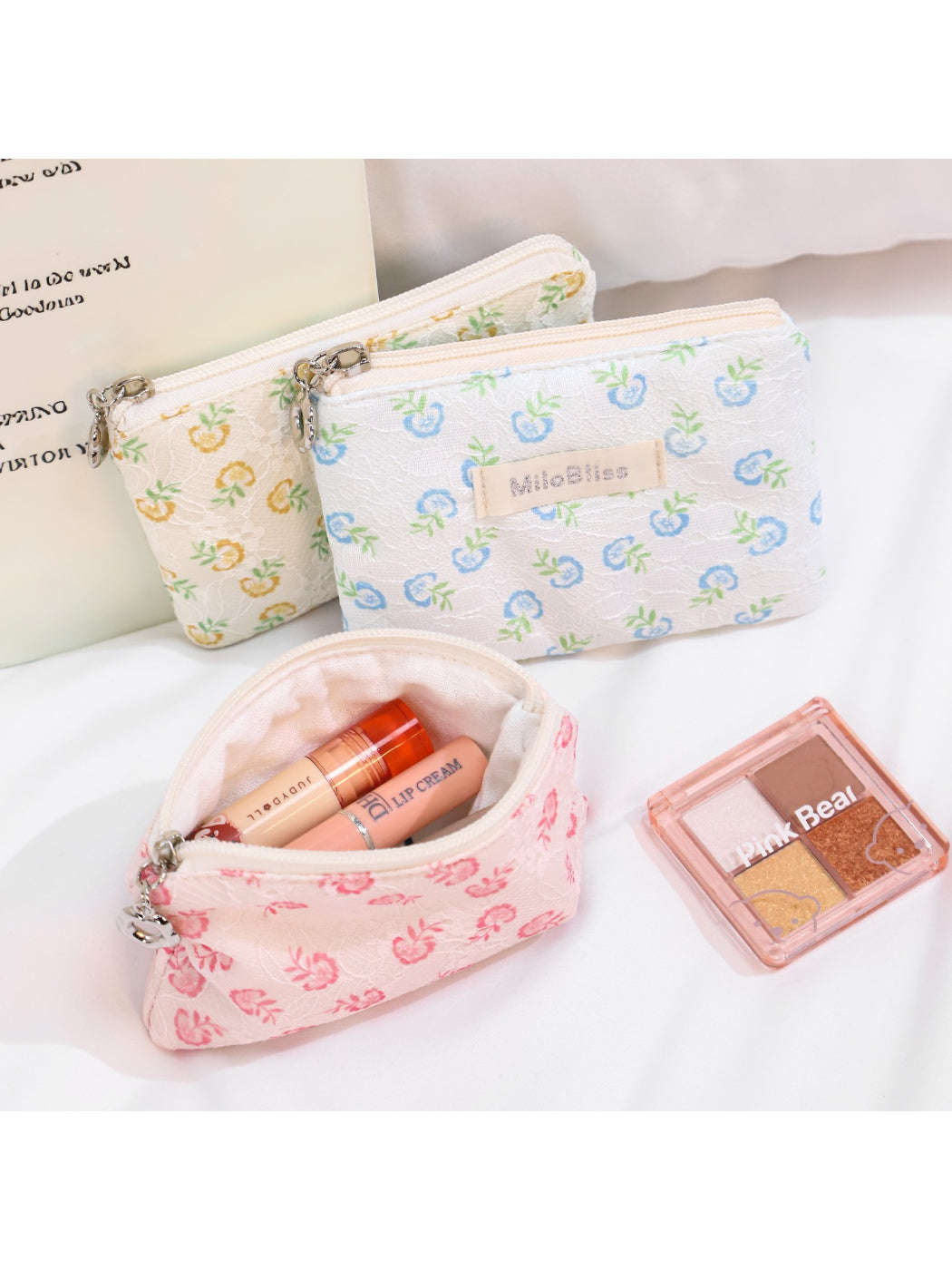 Cosbai floral coin purse held in hand displaying size and floral print