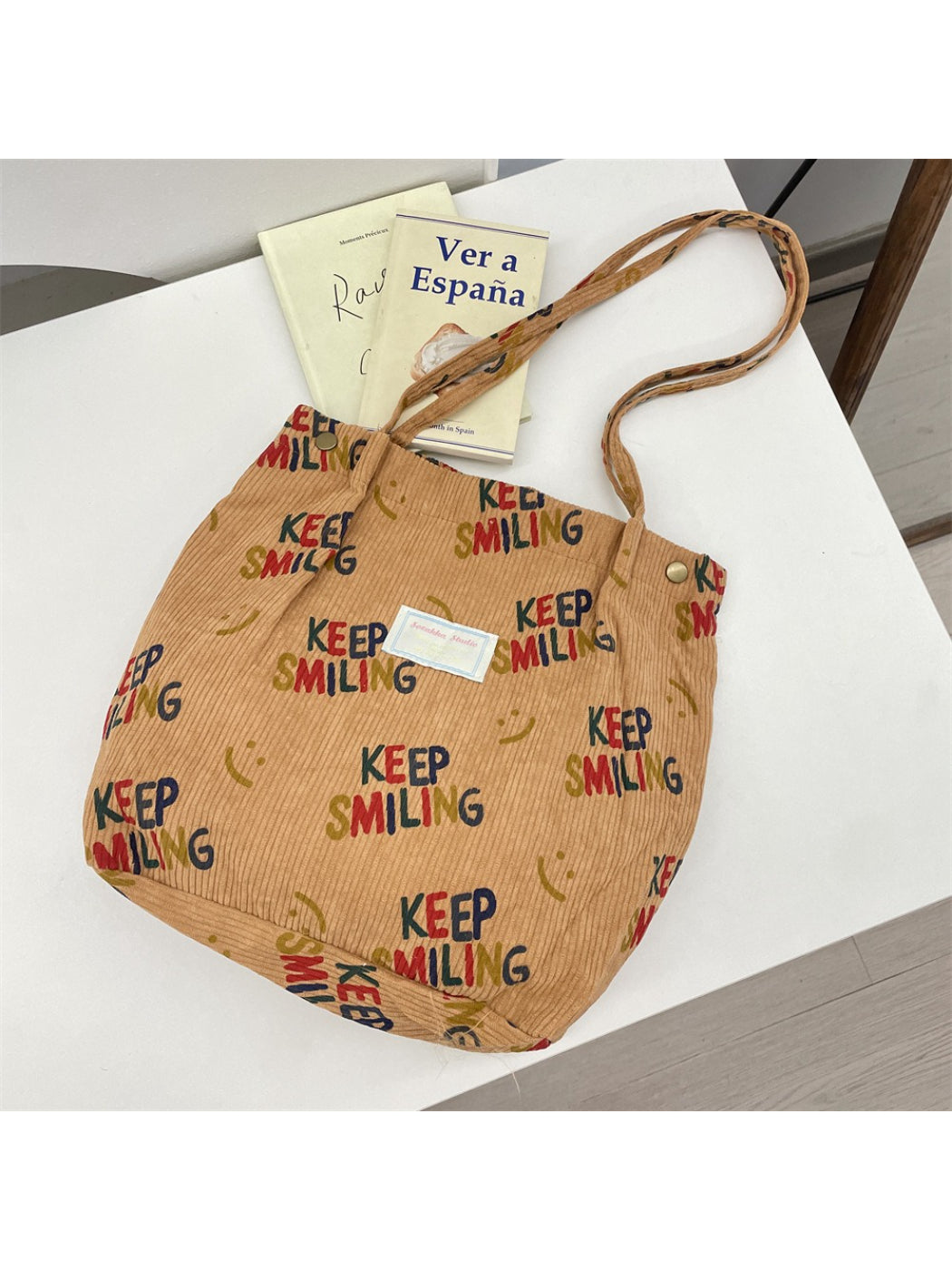 Close-up of Cosbai Keep Smiling Corduroy Tote Bag fabric and stitching