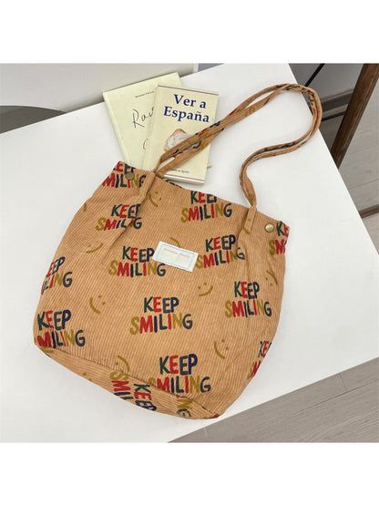 Close-up of Cosbai Keep Smiling Corduroy Tote Bag fabric and stitching