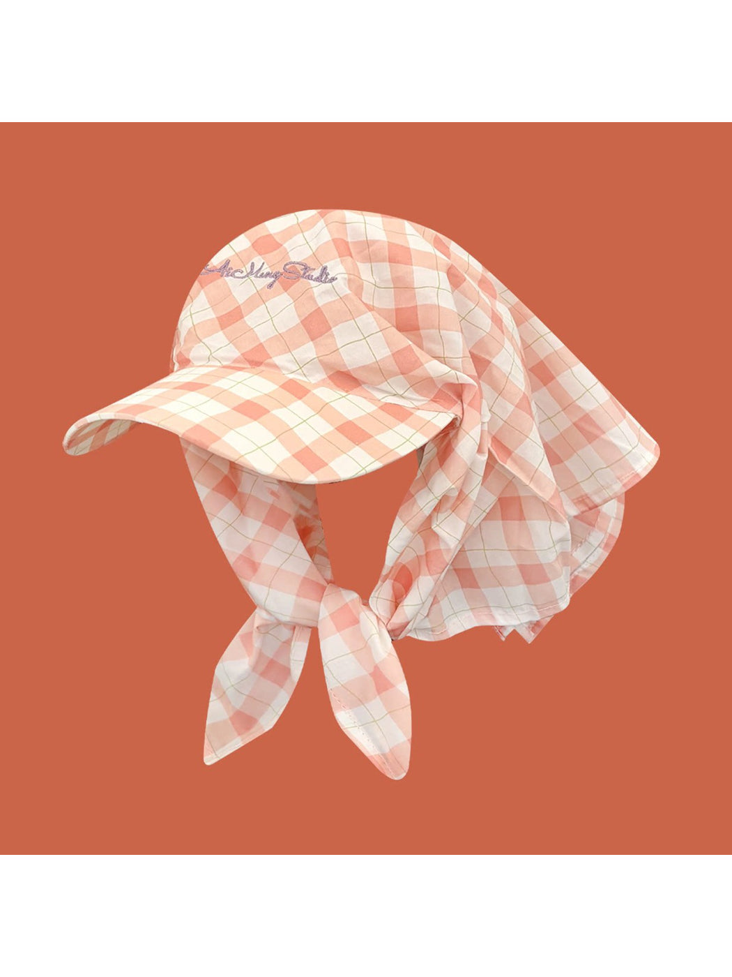 Close-up of Haila plaid tie back visor cap fabric and pattern texture