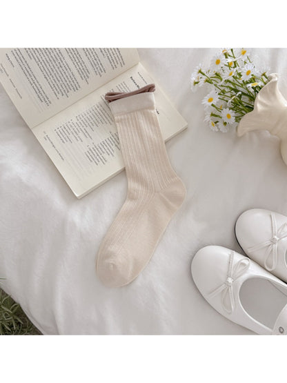 Rufia soft tone ribbed crew socks folded neatly on white background
