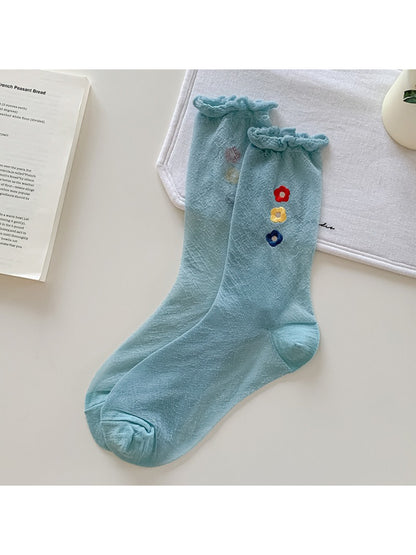 Rufia Sweet Flower Detail Crew Socks folded to show embroidered flower detail on ankle