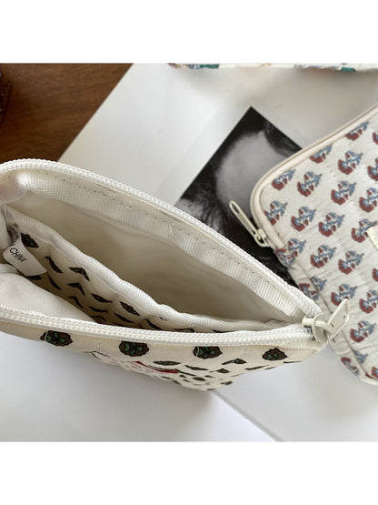 Cosbai mini storage pouch with playful cartoon characters printed on fabric