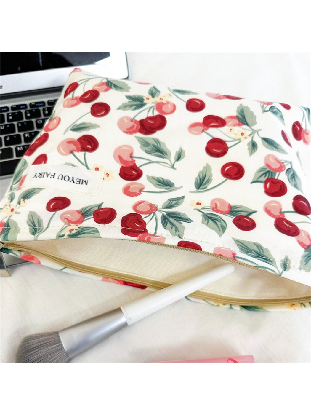Cosbai Sweet Cherry Makeup Pouch displayed with makeup brushes and lipstick