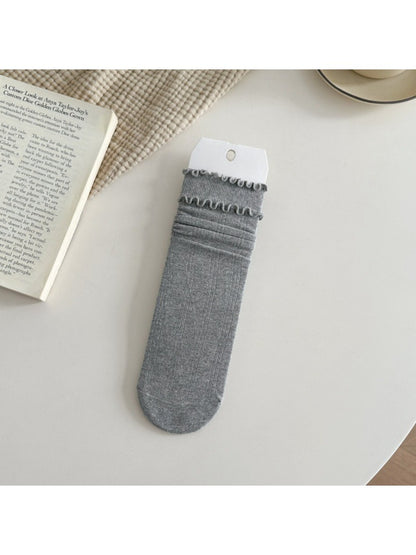 Rufia ruffle mid-calf socks in soft pink color displayed flat
