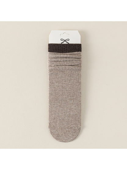 Packaging of Rufia ribbed mid-calf socks for women showing brand label and product details
