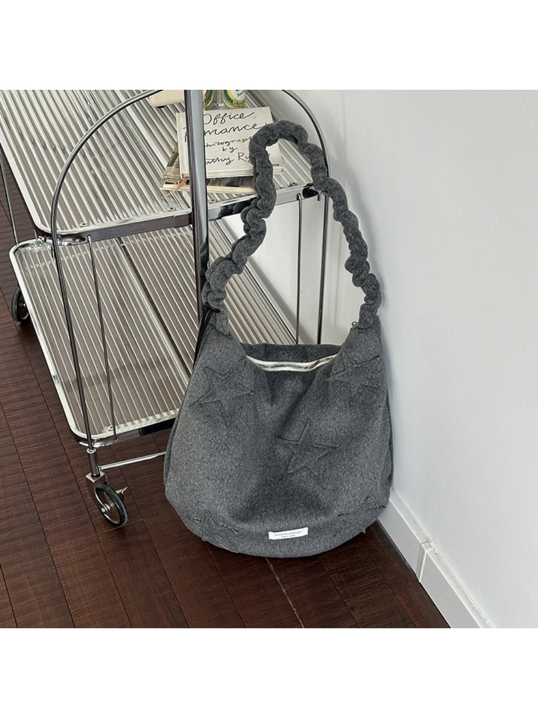 Side view of Cosbai slouchy shoulder bag showing soft, slouchy shape