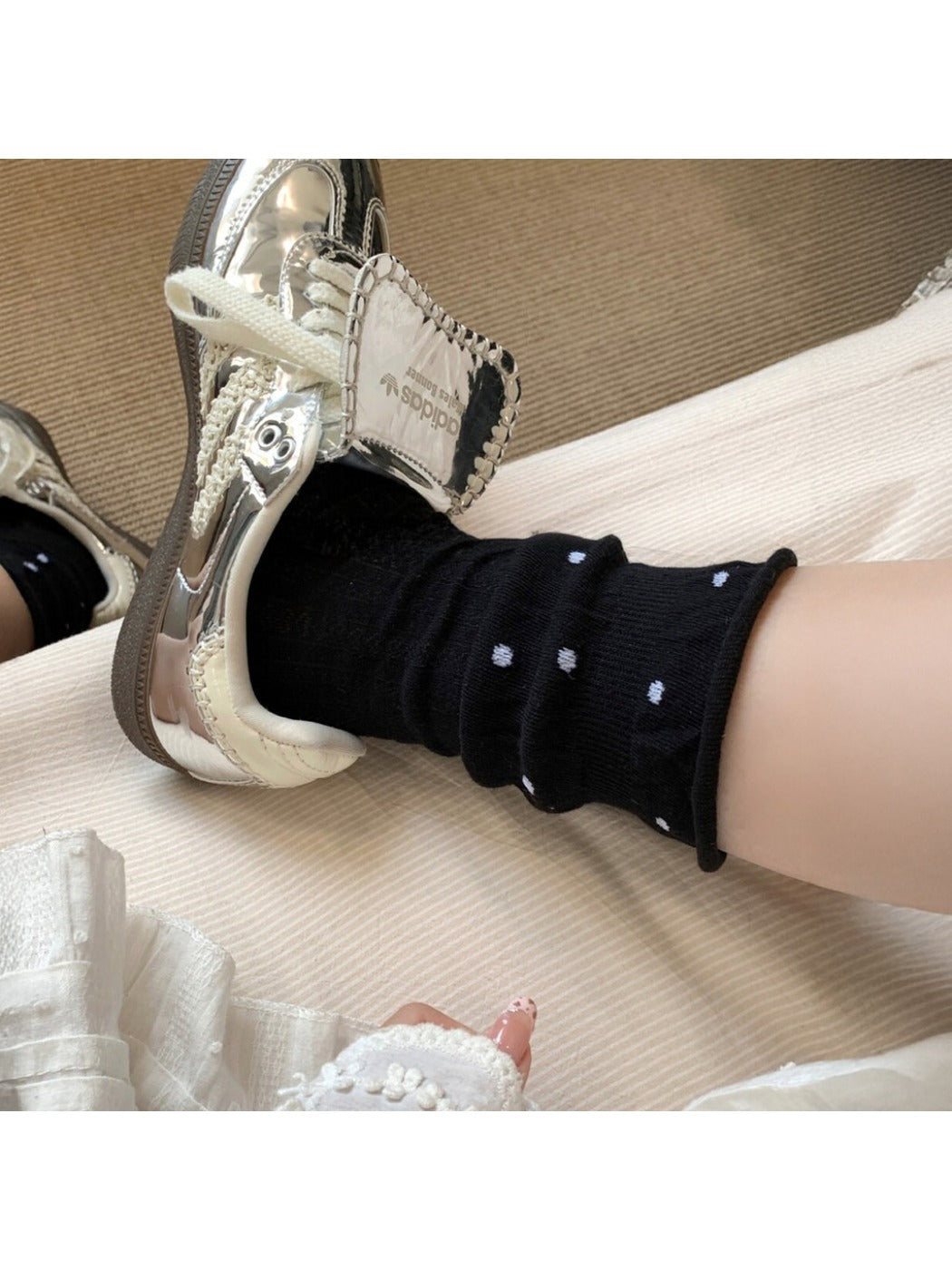 Rufia ruffle mesh dot mid-calf socks worn with shoes, showing sock length and design