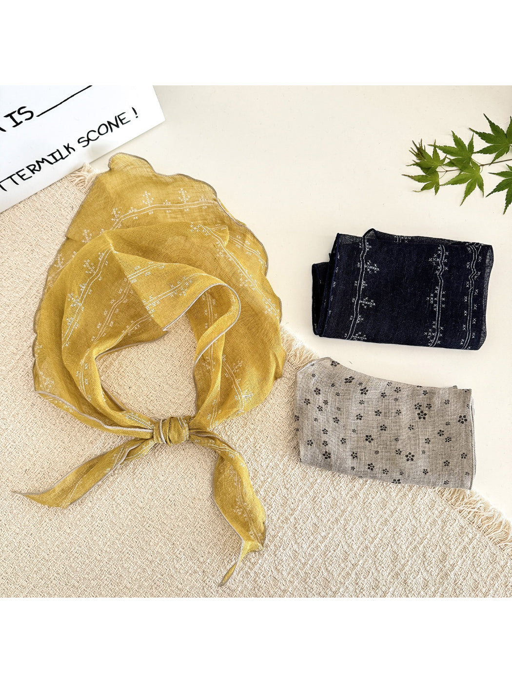 Scarvii lightweight textured tie head scarf folded on a white background