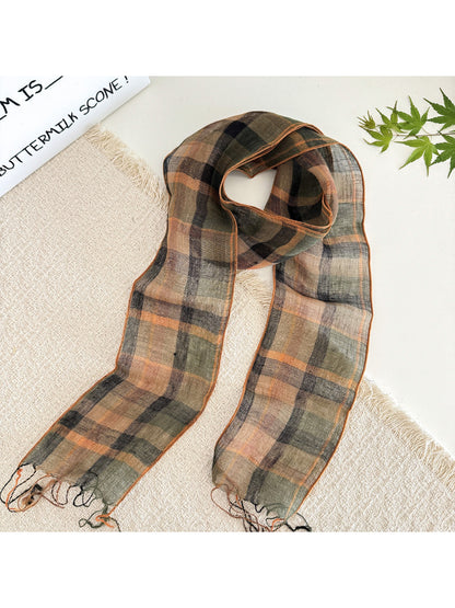 Soft check pattern long skinny scarf draped over a chair highlighting fabric flow