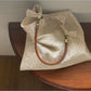 Ivory hobo bag with intricate pattern and soft texture