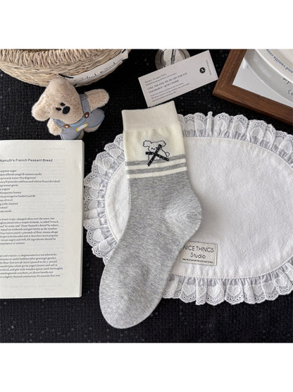 Rufia knit socks folded neatly with pattern and colors visible