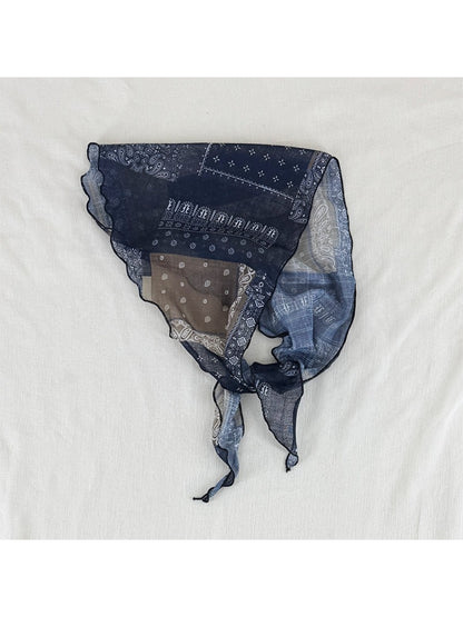Scarvii sheer triangle scarf with black and white bandana print on a white background