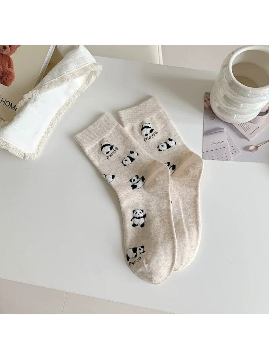 Packaging of Rufia Playful Panda crew socks with panda illustration and branding